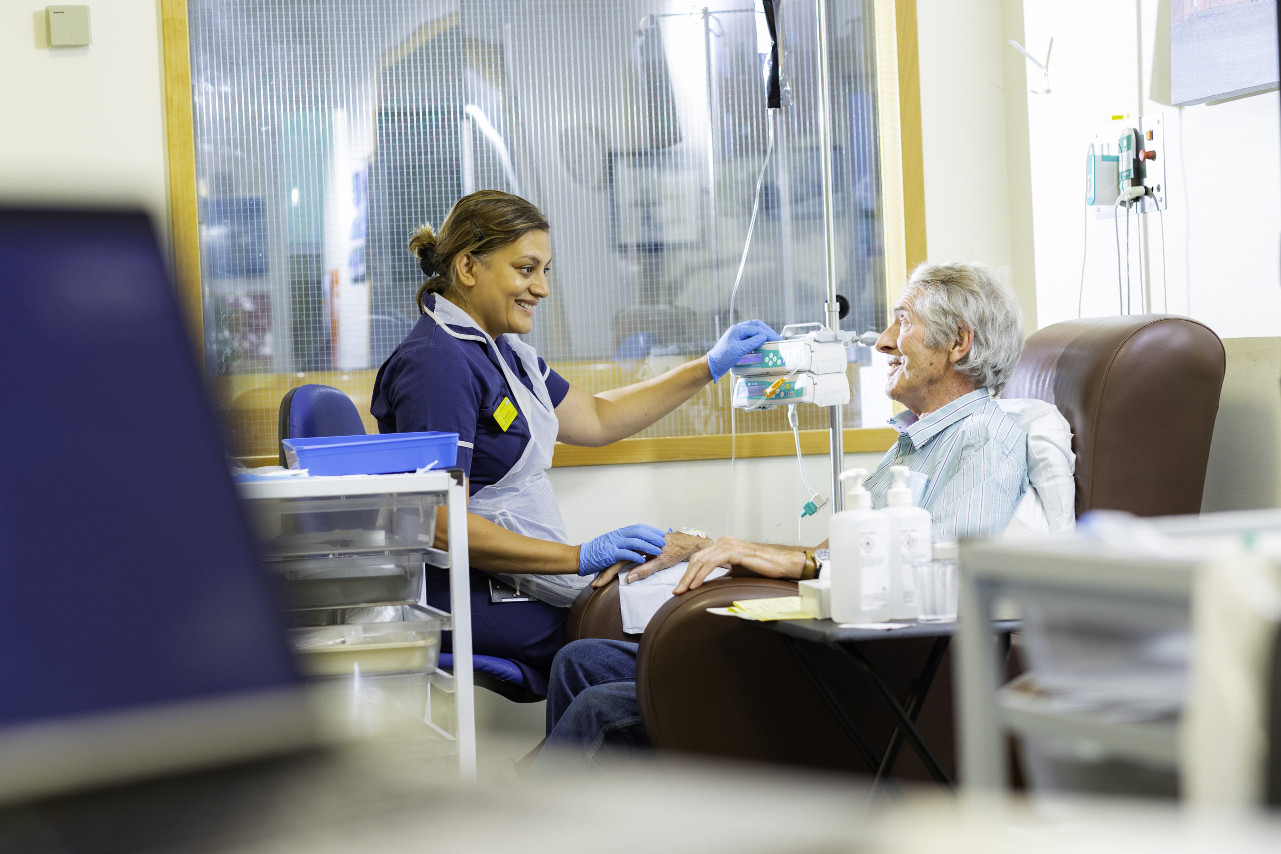 NHS healthcare professionals providing medical care and support in a hospital setting