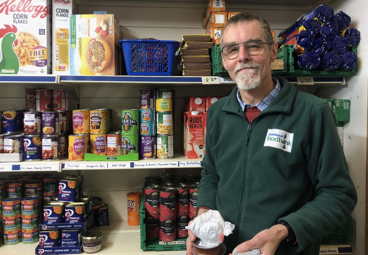 Volunteer packing a food box